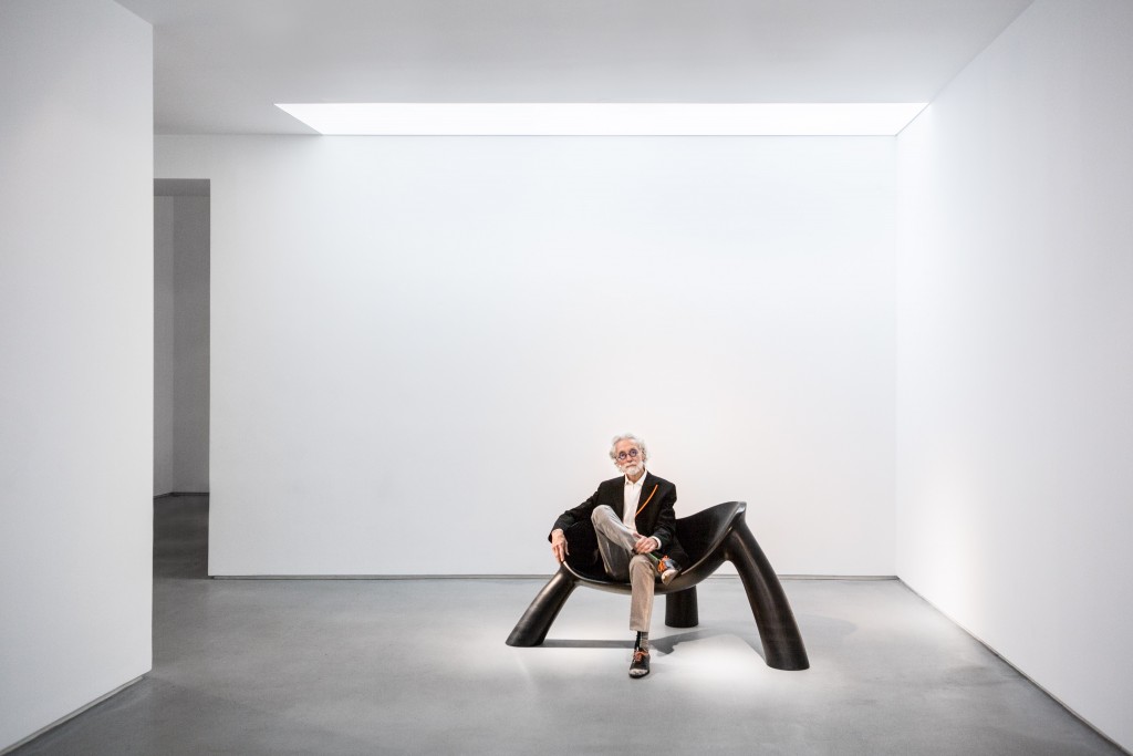 Portrait of Wendell Castle seated on Long Night (2011) Photo by Adrien Millot, courtesy of Friedman Benda and the artist